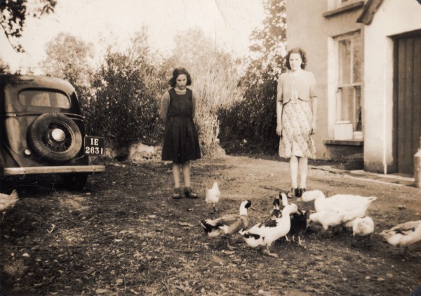 Two young ladies in garden