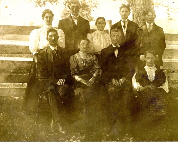 Informal family portrait taken on farm